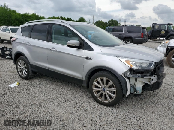 2017 Ford Escape Titanium with VIN 1FMCU0J96HUC12822, listed as a Copart auction lot 54259375 with 127,114 mi miles and Salvage Title. Bid and sale history available at DreamBid. Image 4.