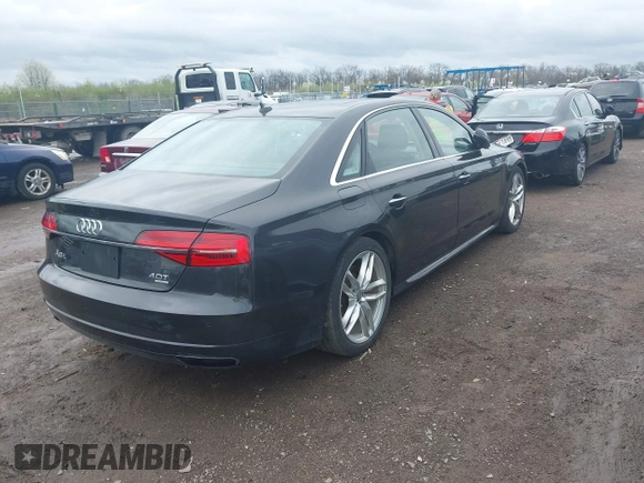 2016 Audi A8 L 4.0T Sport with VIN WAU43AFD3GN020763, listed as a IAAI auction lot 41951858 with 104,563 mi miles. Bid and sale history available at carsss.com. Image 4.