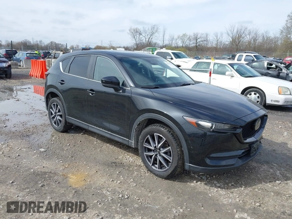 2018 Mazda CX-5 Touring with VIN JM3KFBCMXJ0438177, listed as a IAAI auction lot 42152275 with 65,434 mi miles and . Bid and sale history available at carsss.com. Image 1.