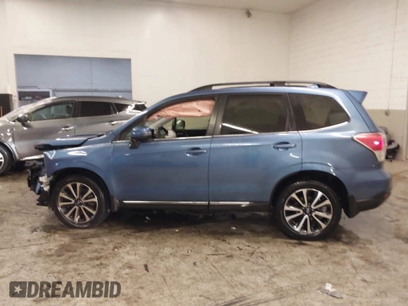 2017 Subaru Forester Touring with VIN JF2SJGTC9HH410251, listed as a IAAI auction lot 41411079 with 131,220 mi miles and . Bid and sale history available at DreamBid. Image 14.