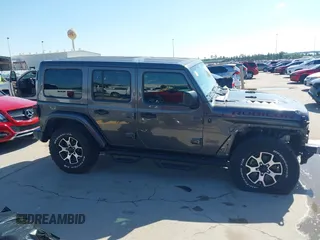 2020 Jeep Wrangler Unlimited Rubicon z VIN 1C4HJXFN0LW300344, wystawiony jako IAAI lot #41943662 z przebiegiem 59 051 mil mil oraz . Historia ofert i sprzedaży dostępna na DreamBid. Obrazek 13.