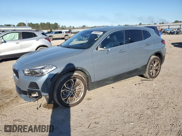 2022 BMW X2 xDrive28i with VIN WBXYJ1C0XN5T67566, listed as a Copart auction lot 86689864 with 42,496 mi miles and Salvage Title. Bid and sale history available at carsss.com. Image 1.