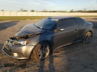 2011 Scion tC z VIN JTKJF5C78B3018619, wystawiony jako Copart lot #48908885 z przebiegiem 179 769 mil mil oraz Szkoda całkowita • Salvage title. Historia ofert i sprzedaży dostępna na DreamBid. Obrazek 1.