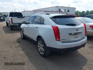 2014 Cadillac SRX Performance Collection with VIN 3GYFNFE34ES677712, listed as a IAAI auction lot 42668059 with 150,135 mi miles and . Bid and sale history available at DreamBid. Image 3.
