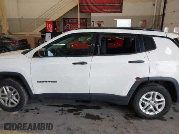 2018 Jeep Compass Sport with VIN 3C4NJCAB6JT124198, listed as a IAAI auction lot 41192196 with 104,557 mi miles. Bid and sale history available at carsss.com. Image 14.