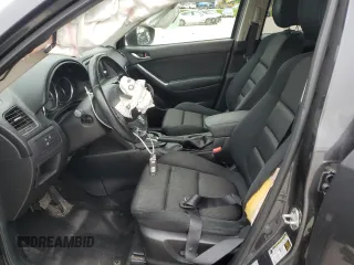 2014 Mazda CX-5 Touring z VIN JM3KE4CY2E0368729, wystawiony jako Copart lot #55563645 z przebiegiem 204 521 mil mil oraz Szkoda całkowita • Salvage title. Historia ofert i sprzedaży dostępna na DreamBid. Obrazek 7.