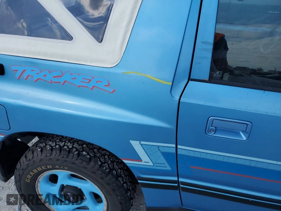 1994 Geo Tracker z VIN 2CNBE18U0R6940807, wystawiony jako Copart lot #78071244 z przebiegiem 116 472 mil mil oraz Nie do naprawy. Historia ofert i sprzedaży dostępna na DreamBid. Obrazek 12.