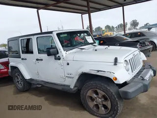 2017 Jeep Wrangler Unlimited Sahara with VIN 1C4HJWEG0HL595144, listed as a IAAI auction lot 41644511 with 143,512 mi miles. Bid and sale history available at carsss.com. Image 14.