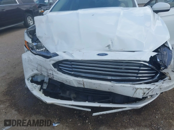 2018 Ford Fusion S z VIN 3FA6P0G71JR166706, wystawiony jako IAAI lot #42275722 z przebiegiem 33 752 mil mil oraz . Historia ofert i sprzedaży dostępna na DreamBid. Obrazek 6.