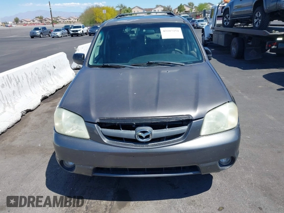 2003 Mazda Tribute ES with VIN 4F2CZ96113KM52877, listed as a IAAI auction lot 42217251 with 218,475 mi miles and . Bid and sale history available at DreamBid. Image 6.