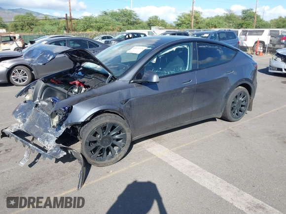 2023 Tesla Model Y Long Range z VIN 7SAYGAEE4PF945847, wystawiony jako IAAI lot #41071924 z przebiegiem 33 454 mil mil oraz . Historia ofert i sprzedaży dostępna na DreamBid. Obrazek 18.
