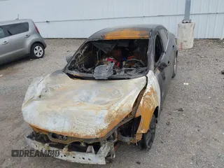 2014 Mazda 3 i Touring z VIN JM1BM1V71E1215932, wystawiony jako IAAI lot #42138164 z przebiegiem Nie podano mil oraz . Historia ofert i sprzedaży dostępna na DreamBid. Obrazek 6.