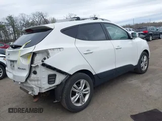 2013 Hyundai Tucson GLS with VIN KM8JU3AC5DU693550, listed as a IAAI auction lot 41919615 with 202,517 mi miles. Bid and sale history available at carsss.com. Image 4.