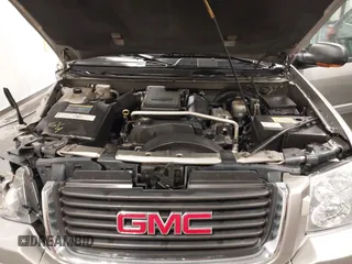 2003 GMC Envoy SLT with VIN 1GKDT13S932395367, listed as a IAAI auction lot 41544810 with 142,012 mi miles. Bid and sale history available at carsss.com. Image 10.