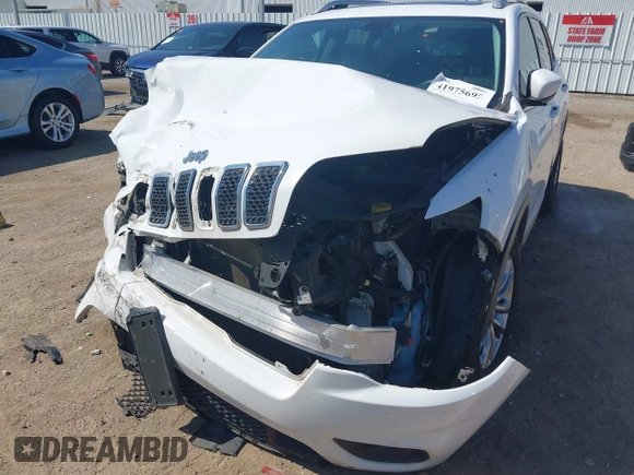 2019 Jeep Cherokee Latitude Plus with VIN 1C4PJLLB4KD455861, listed as a IAAI auction lot 41975695 with 104,413 mi miles. Bid and sale history available at carsss.com. Image 6.