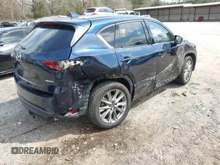 2021 Mazda CX-5 Grand Touring with VIN JM3KFBDM8M0484383, listed as a IAAI auction lot 41800786 with 58,617 mi miles. Bid and sale history available at carsss.com. Image 4.