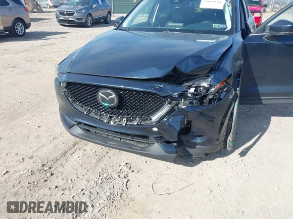 2019 Mazda CX-5 Touring with VIN JM3KFBCM8K0518806, listed as a IAAI auction lot 42038168 with 61,449 mi miles and . Bid and sale history available at DreamBid. Image 6.