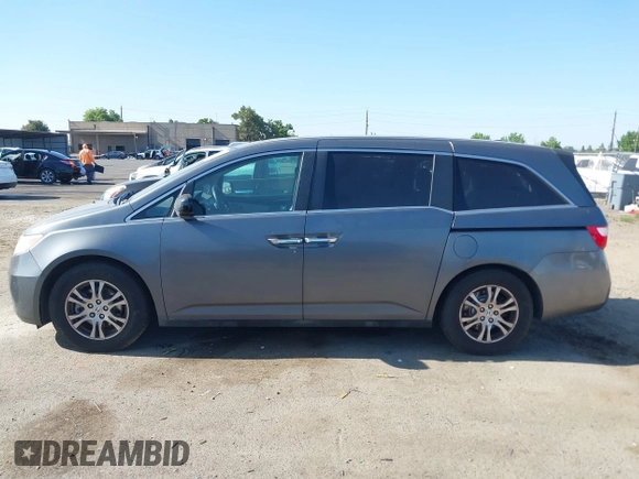 2012 Honda Odyssey EX-L with VIN 5FNRL5H6XCB061026, listed as a IAAI auction lot 42574612 with 144,480 mi miles and . Bid and sale history available at DreamBid. Image 14.