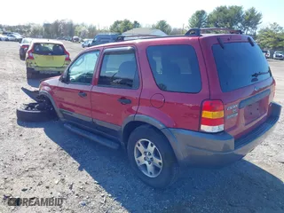 2004 Ford Escape XLT with VIN 1FMCU931X4KB19738, listed as a IAAI auction lot 41925561 with 220,674 mi miles. Bid and sale history available at carsss.com. Image 3.
