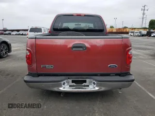 2001 Ford F-150 XLT with VIN 1FTRW07WX1KE51166, listed as a Copart auction lot 60164025 with 157,035 mi miles and Salvage title. Bid and sale history available at DreamBid. Image 6.