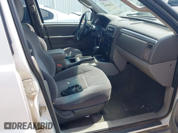 2003 Jeep Grand Cherokee Laredo z VIN 1J4GX48S33C519404, wystawiony jako IAAI lot #42164364 z przebiegiem 174 627 mil mil oraz . Historia ofert i sprzedaży dostępna na DreamBid. Obrazek 5.