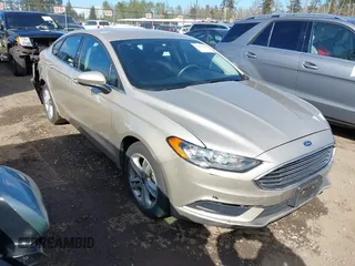 2018 Ford Fusion SE z VIN 3FA6P0LU7JR269141, wystawiony jako IAAI lot #39211405 z przebiegiem 72 209 mil mil oraz . Historia ofert i sprzedaży dostępna na DreamBid. Obrazek 1.