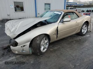 1999 Jaguar XK with VIN SAJGX2047XC041437, listed as a Copart auction lot 75843294 with Not Provided miles and Salvage Title. Bid and sale history available at DreamBid. Image 1.