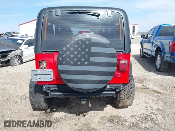 2002 Jeep Wrangler Sport with VIN 1J4FA49S42P771262, listed as a IAAI auction lot 41819403 with 132,871 mi miles. Bid and sale history available at carsss.com. Image 17.