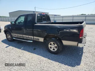 2004 Ford F-150 XL with VIN 2FTRX18W04CA13170, listed as a Copart auction lot 60932775 with 233,249 mi miles and Salvage title. Bid and sale history available at DreamBid. Image 2.