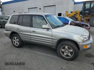 1999 Toyota RAV4 with VIN JT3GP10V0X7054819, listed as a Copart auction lot 44864015 with 140,095 mi miles and Salvage Title. Bid and sale history available at DreamBid. Image 4.