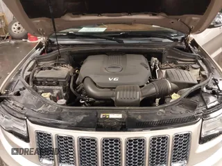 2015 Jeep Grand Cherokee Summit with VIN 1C4RJFJG5FC918837, listed as a IAAI auction lot 41126436 with 155,516 mi miles. Bid and sale history available at carsss.com. Image 10.