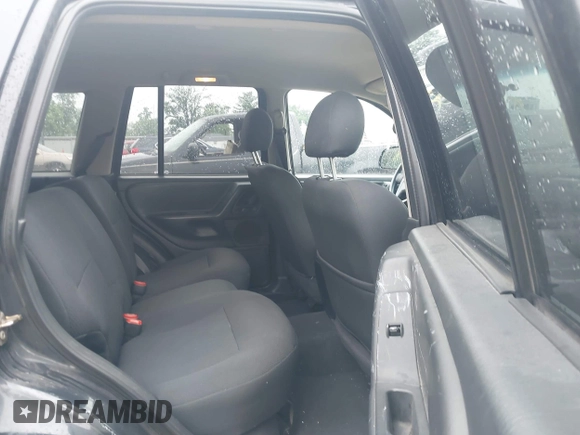 2003 Jeep Grand Cherokee Laredo with VIN 1J4GW48NX3C532874, listed as a IAAI auction lot 42613091 with 165,920 mi miles and . Bid and sale history available at DreamBid. Image 8.