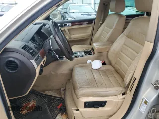 2010 Volkswagen Touareg VR6 with VIN WVGBF7A9XAD002471, listed as a Copart auction lot 83592274 with 202,497 mi miles and Salvage Title. Bid and sale history available at DreamBid. Image 7.