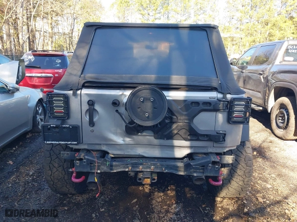 2015 Jeep Wrangler Unlimited Rubicon Hard Rock with VIN 1C4HJWFG1FL777222, listed as a IAAI auction lot 41843893 with 74,718 mi miles. Bid and sale history available at carsss.com. Image 16.