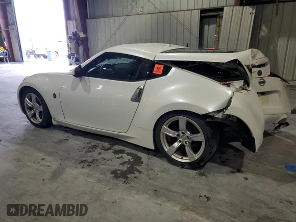 2012 Nissan 370Z z VIN JN1AZ4EH3CM565276, wystawiony jako Copart lot #56654845 z przebiegiem 77 788 mil mil oraz Nie do naprawy. Historia ofert i sprzedaży dostępna na DreamBid. Obrazek 2.