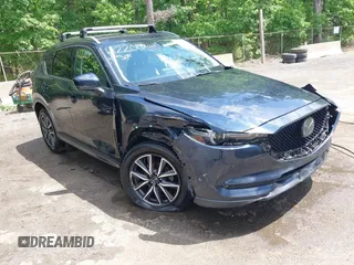 2018 Mazda CX-5 Grand Touring with VIN JM3KFBDM2J0373386, listed as a IAAI auction lot 42200795 with 70,111 mi miles and . Bid and sale history available at DreamBid. Image 6.
