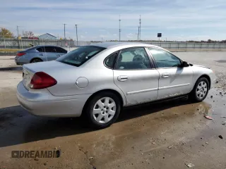 2003 Ford Taurus LX Standard z VIN 1FAFP52U93A159333, wystawiony jako Copart lot #78080944 z przebiegiem 54 652 mil mil oraz Szkoda całkowita • Salvage title. Historia ofert i sprzedaży dostępna na DreamBid. Obrazek 3.