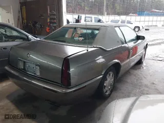 1999 Cadillac Eldorado ESC with VIN 1G6EL12Y8XU612393, listed as a IAAI auction lot 41761839 with 104,994 mi miles. Bid and sale history available at carsss.com. Image 4.
