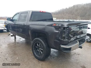 2015 Chevrolet Silverado 1500 LT with VIN 3GCUKRECXFG104194, listed as a IAAI auction lot 41029090 with 149,530 mi miles. Bid and sale history available at carsss.com. Image 3.