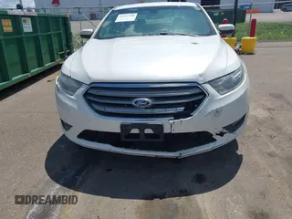 2015 Ford Taurus SEL z VIN 1FAHP2E82FG105766, wystawiony jako IAAI lot #42327700 z przebiegiem 187 185 mil mil oraz . Historia ofert i sprzedaży dostępna na DreamBid. Obrazek 13.