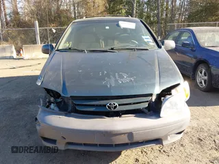 2001 Toyota Sienna LE z VIN 4T3ZF13C51U324527, wystawiony jako IAAI lot #41622465 z przebiegiem 145 450 mil mil oraz . Historia ofert i sprzedaży dostępna na DreamBid. Obrazek 12.