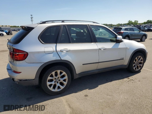 2012 BMW X5 35i with VIN 5UXZV4C5XCL749204, listed as a Copart auction lot 62012985 with 94,636 mi miles and Clean title. Bid and sale history available at DreamBid. Image 3.