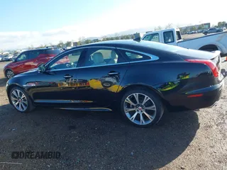 2015 Jaguar XJ with VIN SAJWA1CZ2F8V84677, listed as a IAAI auction lot 41723372 with 52,888 mi miles. Bid and sale history available at carsss.com. Image 14.