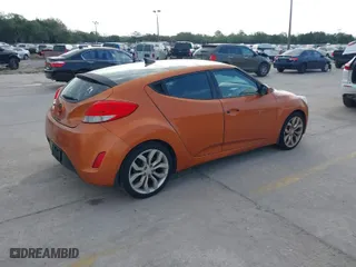 2012 Hyundai Veloster w/Gray Int with VIN KMHTC6AD5CU074516, listed as a IAAI auction lot 41515533 with 133,338 mi miles. Bid and sale history available at carsss.com. Image 4.