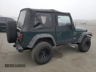 1999 Jeep Wrangler Sport z VIN 1J4FY19SXXP427968, wystawiony jako Copart lot #50102855 z przebiegiem 174 381 mil mil oraz Czysty tytuł • Clean title. Historia ofert i sprzedaży dostępna na DreamBid. Obrazek 3.