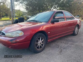 1999 Ford Contour SE Fleet z VIN 1FAFP66L2XK149217, wystawiony jako Copart lot #79546104 z przebiegiem 231 245 mil mil oraz Tytuł czysty. Historia ofert i sprzedaży dostępna na DreamBid. Obrazek 2.