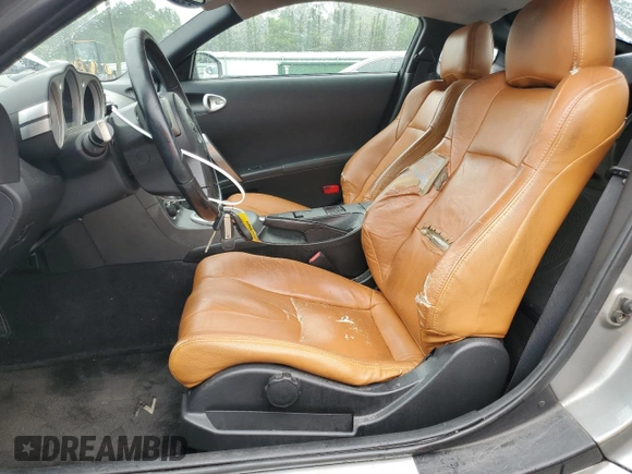 2003 Nissan 350Z Performance z VIN JN1AZ34D33T106988, wystawiony jako Copart lot #57933985 z przebiegiem 203 959 mil mil oraz Szkoda całkowita • Salvage title. Historia ofert i sprzedaży dostępna na DreamBid. Obrazek 7.