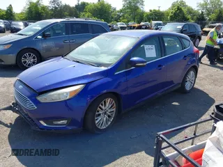 2015 Ford Focus Titanium z VIN 1FADP3N25FL291844, wystawiony jako IAAI lot #42383067 z przebiegiem 82 545 mil mil oraz . Historia ofert i sprzedaży dostępna na DreamBid. Obrazek 17.