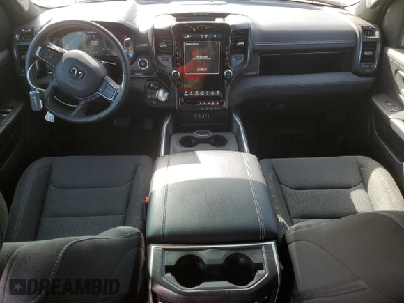 2023 Ram 1500 Limited with VIN 1C6SRFHT1PN576104, listed as a Copart auction lot 48064355 with 23,874 mi miles and Salvage title. Bid and sale history available at DreamBid. Image 8.
