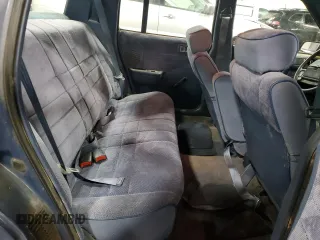 1991 Dodge Spirit z VIN 1B3XA46K9MF628235, wystawiony jako Copart lot #83581274 z przebiegiem 117 774 mil mil oraz Szkody całkowita. Historia ofert i sprzedaży dostępna na DreamBid. Obrazek 10.
